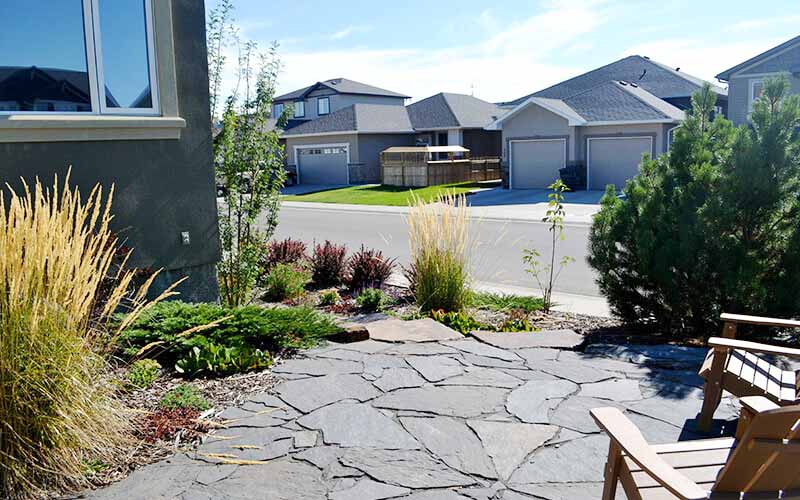 Lethbridge, Alberta, Landscaping, Landscapes, Landscape contractor, Landscape design Lethbridge. Naturalstone, resting area, patio, lawn